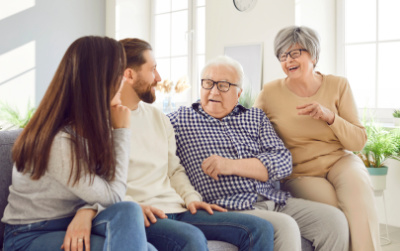 Adult children talking with an aging parent about future senior living and long-term care options.
